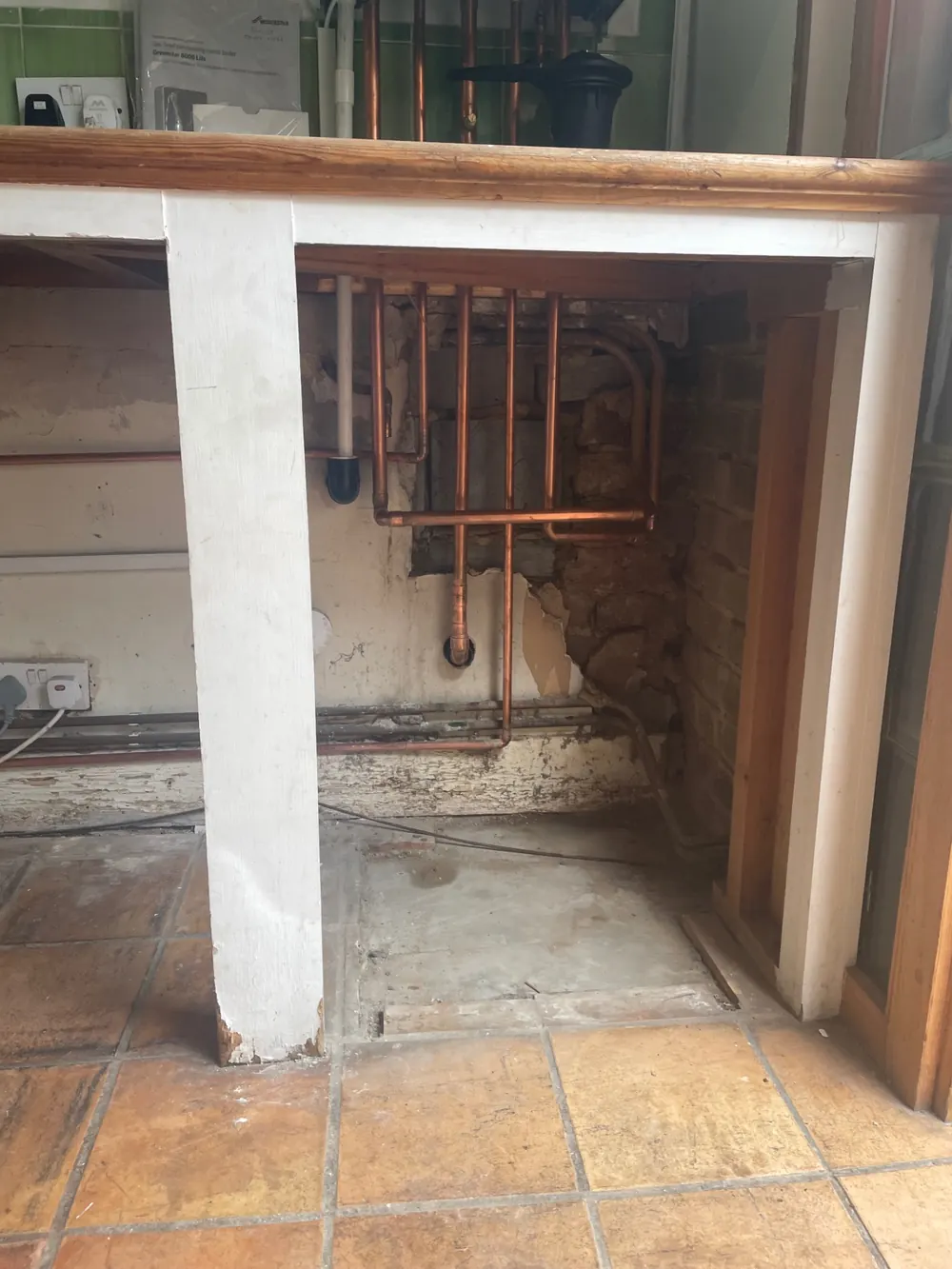 First-fix copper pipework prepared for a new combi boiler installation